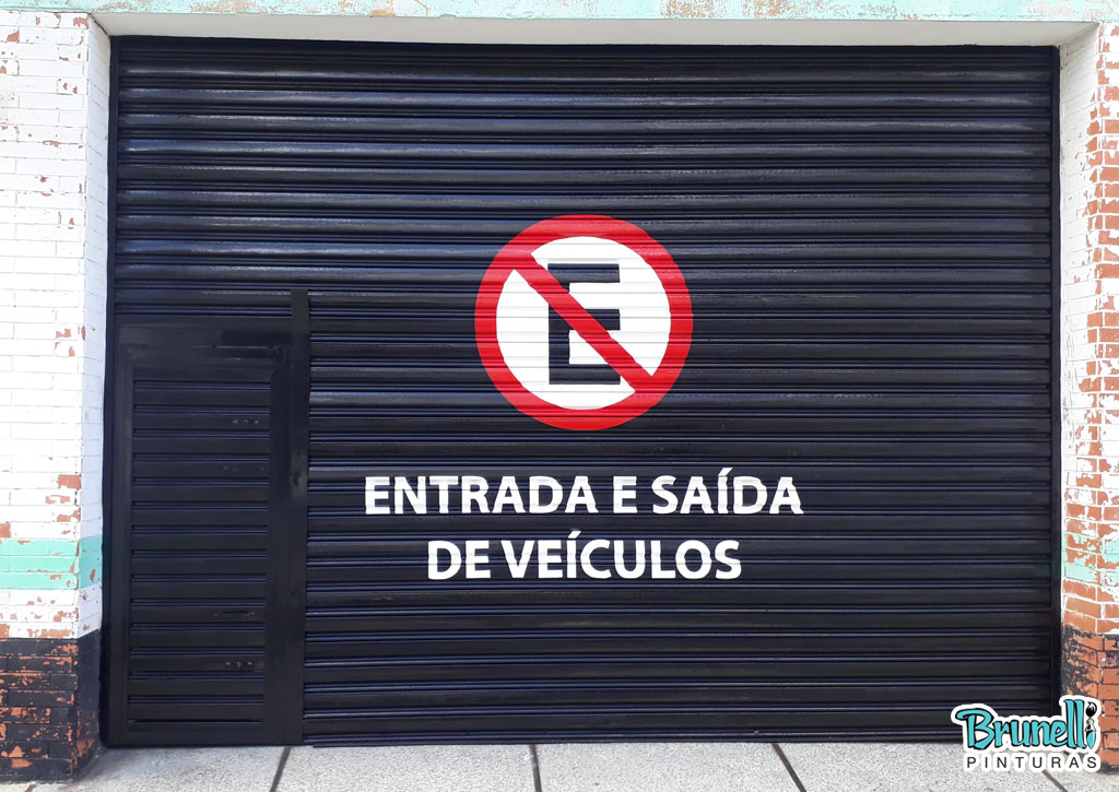 pintura de letreiro em porta de aço proibido estacionar