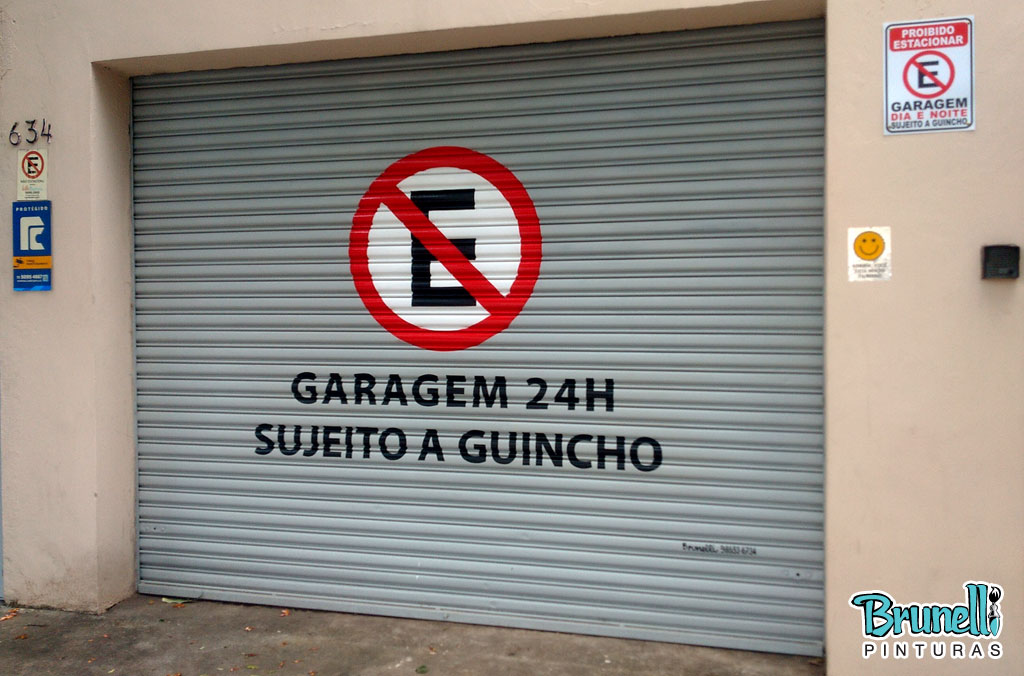 pintura de letreiro em porta de aço proibido estacionar